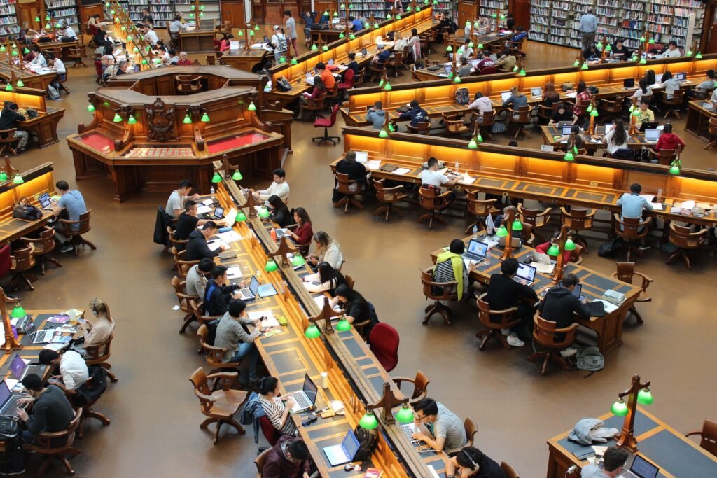 Postgraduate students studying in a university library for SENSS ESRC Studentships 2027