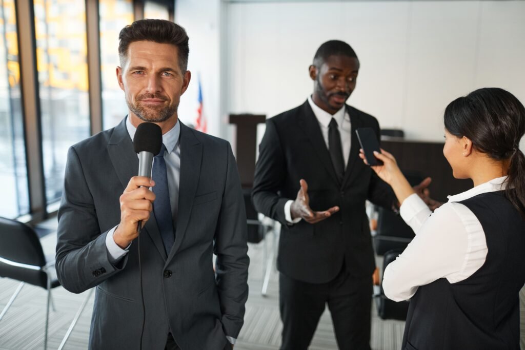 Professional television reporter covering an interview, illustrating the Erasmus Mundus Journalism Scholarship 2027