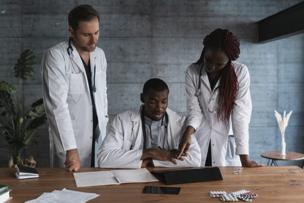 Healthcare professionals collaborating and sharing knowledge, illustrating the UGHE Mastercard Foundation Scholarship 2027